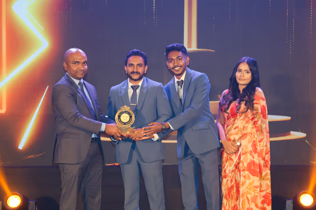 The Most Popular Micro Enterprises Website trophy handed over on stage.