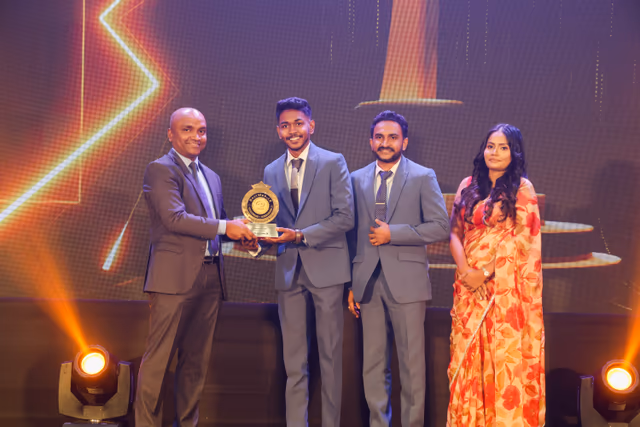 Receiving the Gold Winner trophy for Best Micro Enterprises Website of the Year.